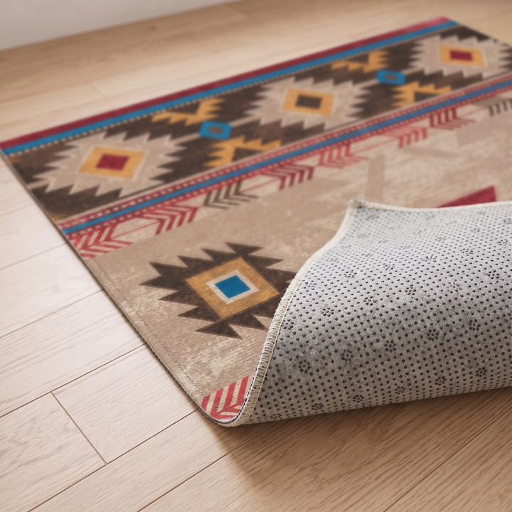 Washable Kilim-Style Rug in Beige Kilim – corner folded back to show the non-slip dotted backing on wood flooring