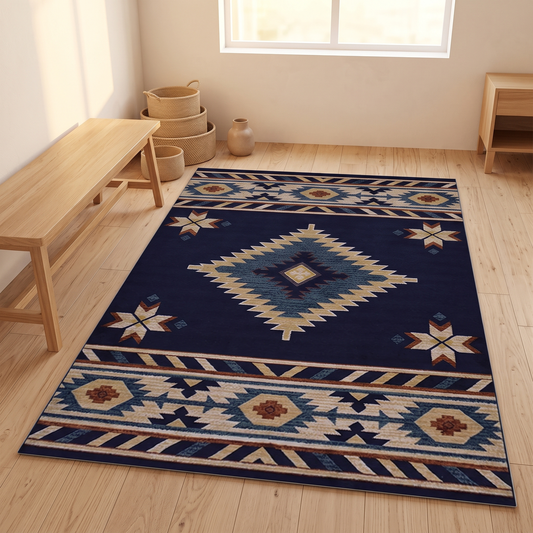 Washable Kilim-Style Rug in Navy Kilim – laid on light wood floor with a bench, baskets and vase nearby