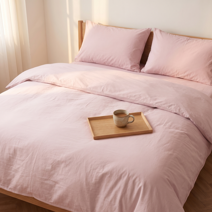 Washed Cotton Duvet Cover Set in Dusty Pink – wooden tray with a mug of coffee on the duvet