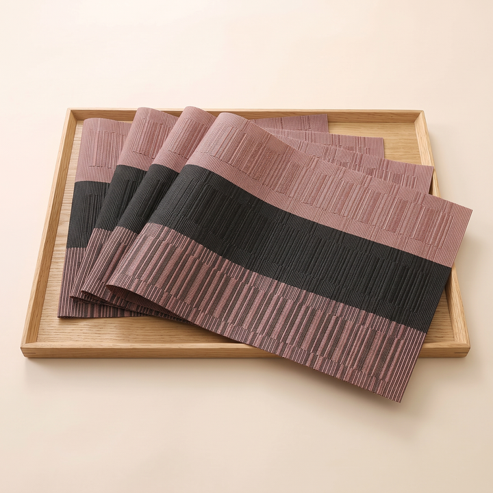 Woven Placemats – Wipe Clean in Black &amp; Rose – Block Stripe – shingled in a row inside a square light wood tray