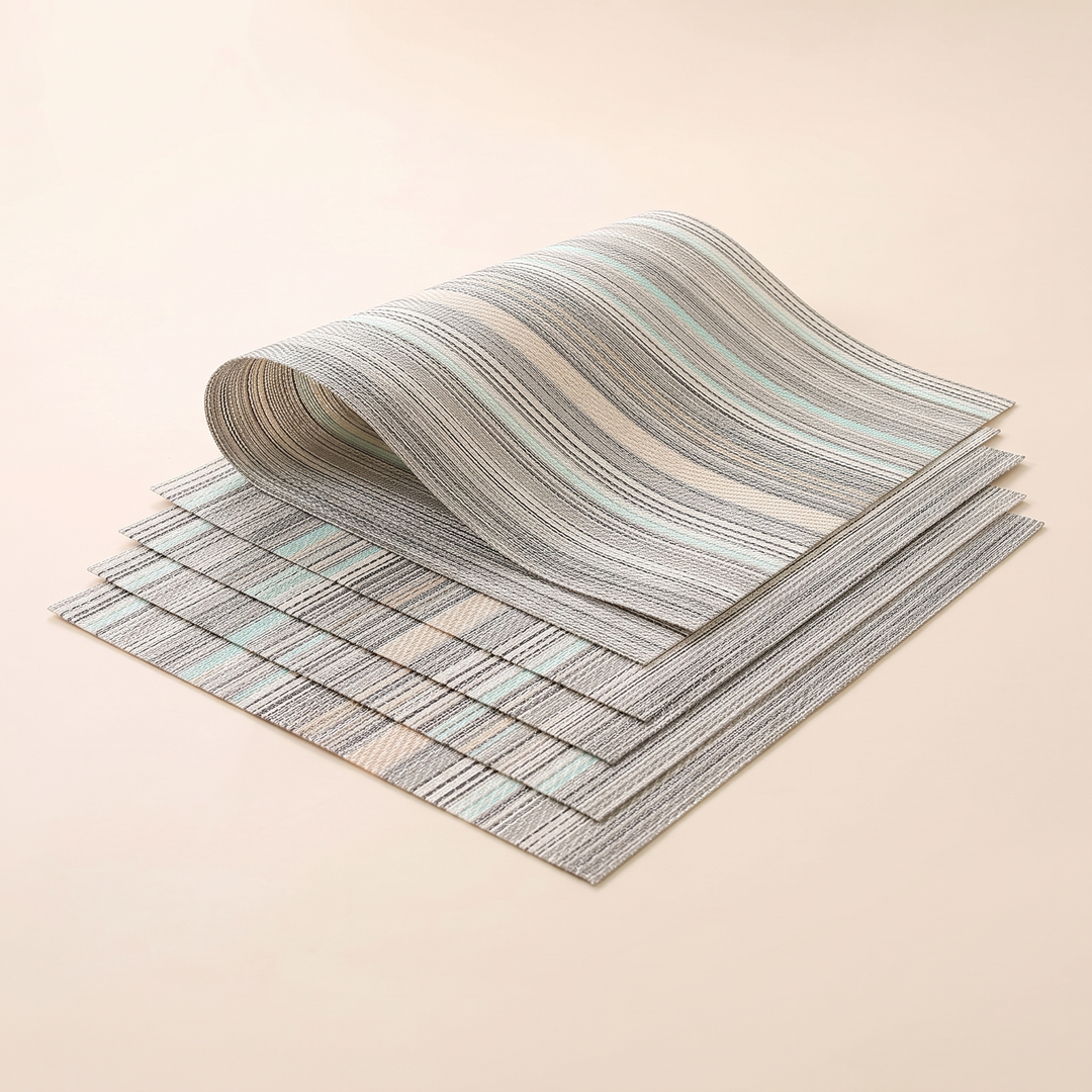 Woven Placemats – Wipe Clean in Mint – Stripe – top mat rolled into a loose wave over fanned stack