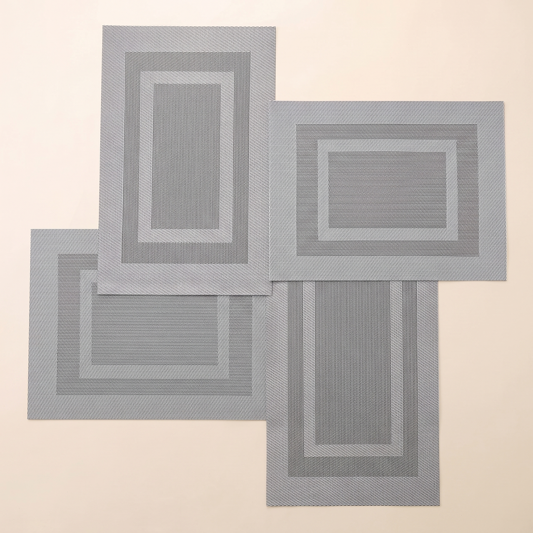 Woven Placemats – Wipe Clean in Silver – Frame – four mats alternating upright and sideways in a pinwheel arrangement
