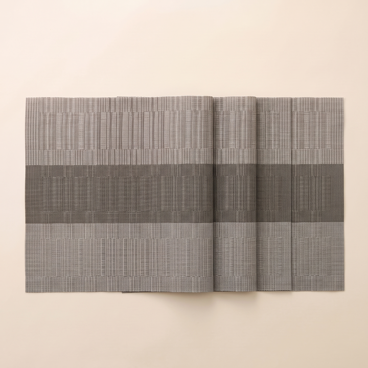 Woven Placemats – Wipe Clean in Taupe &amp; Gray – Block Stripe – overhead view of mats overlapping with staggered right edges