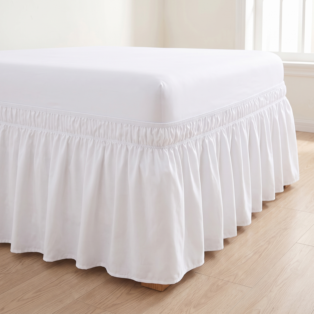 Wrap-Around Ruffled Bed Skirt in White – full ruffled drop reaching the floor beside a sunlit window